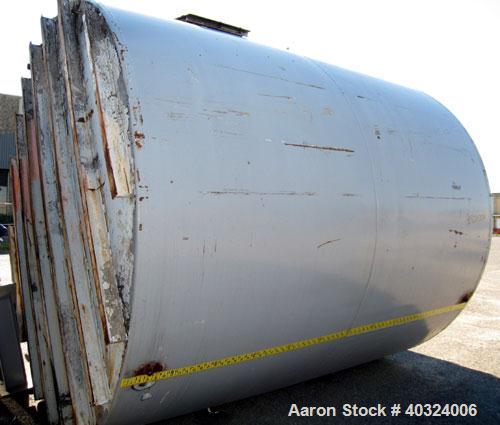 Used Tank, 8500 gallon, carbon steel,  vertical. Approximately 11' diameter x 12' straight side, dished top, flat bottom. Top manway, 4" NPT end bottom outlet.