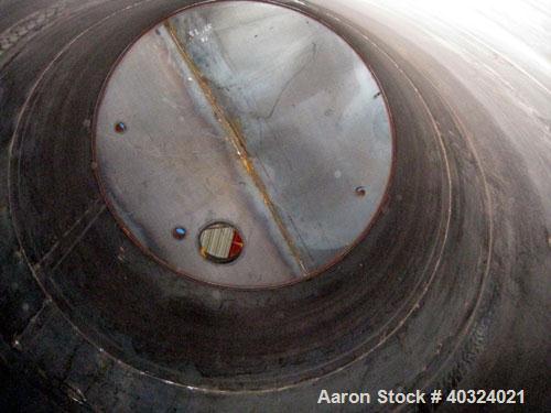 Unused: Highland tank, 16,920 gallon, carbon steel, vertical. Approximately 12' diameter x 20' straight side, slight coned top, flat bottom. U.L. 142 labeled for above ground flammable storage. Openi...