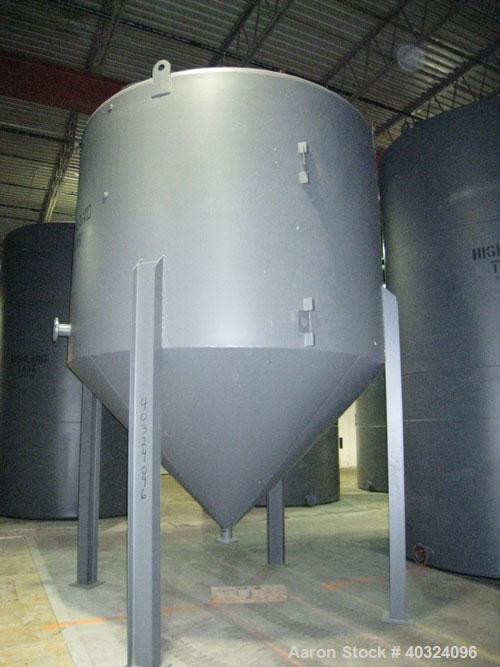 Unused: Highland tank, 6,000 gallon, carbon steel, vertical. Approximately 11' diameter x 8' straight side. Dished top, coned bottom. Openings: top 4", and a manway; side 4"; 4" center bottom outlet....