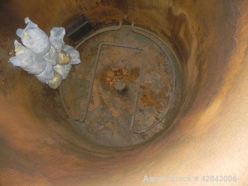 Used Tank, Carbon Steel, 9,500 Gallon, Vertical. Approximately 120" diameter x 192" straight side. Slight coned top and bottom. Openings top 8", Side bottom opening, 3-1/2" tangential center bottom o...