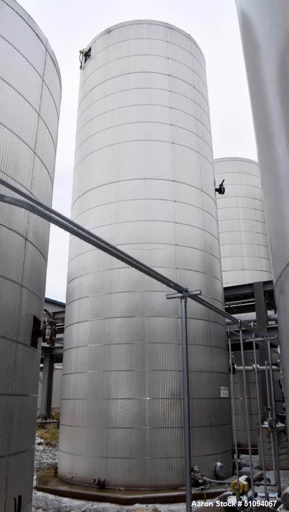 Used Squibb Tank Company Aboveground Flammable Liquid Tank, 29,600 Gallon, A36 Carbon Steel, Vertical. Approximate 143" diameter x 420" straight side, cone top, flat bottom. Design temperature to 350...