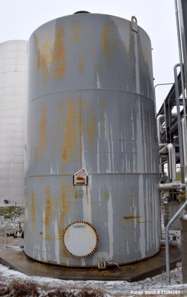 Used Squibb Tank Company Above-ground Flammable Liquid Tank, 15,000 Gallon, A36 Carbon Steel, Vertical. Approximate 143" diameter x 216" straight side, cone top, flat bottom. Openings top 4", 18" man...