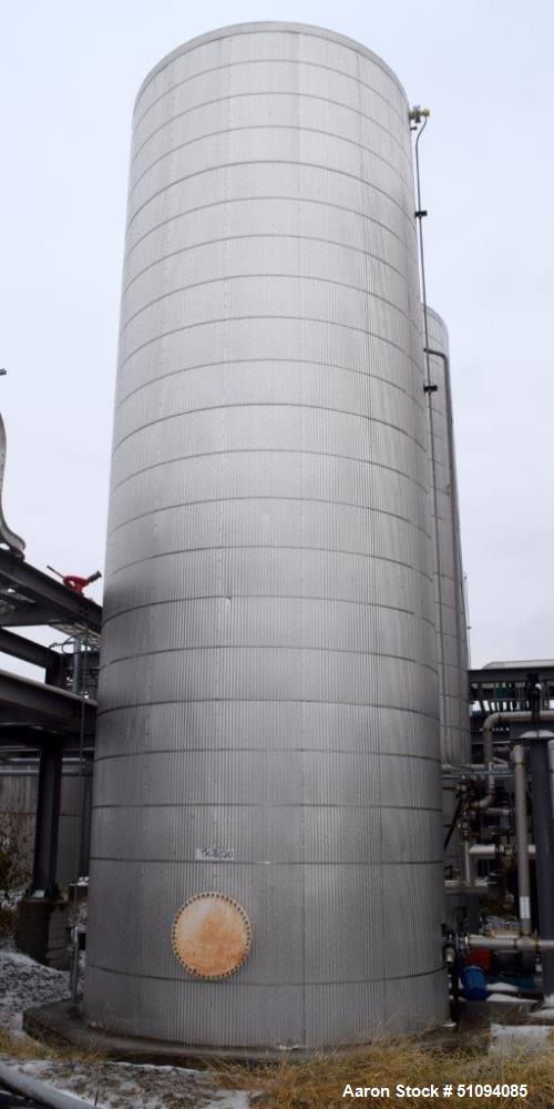 Used Tank, Approximate 29,000 Gallon, Carbon Steel, Vertical. Approximate 144" diameter x 420" straight side, cone top, flat bottom. Side man way and side outlet. No manufacturers tag visible.  ** Th...