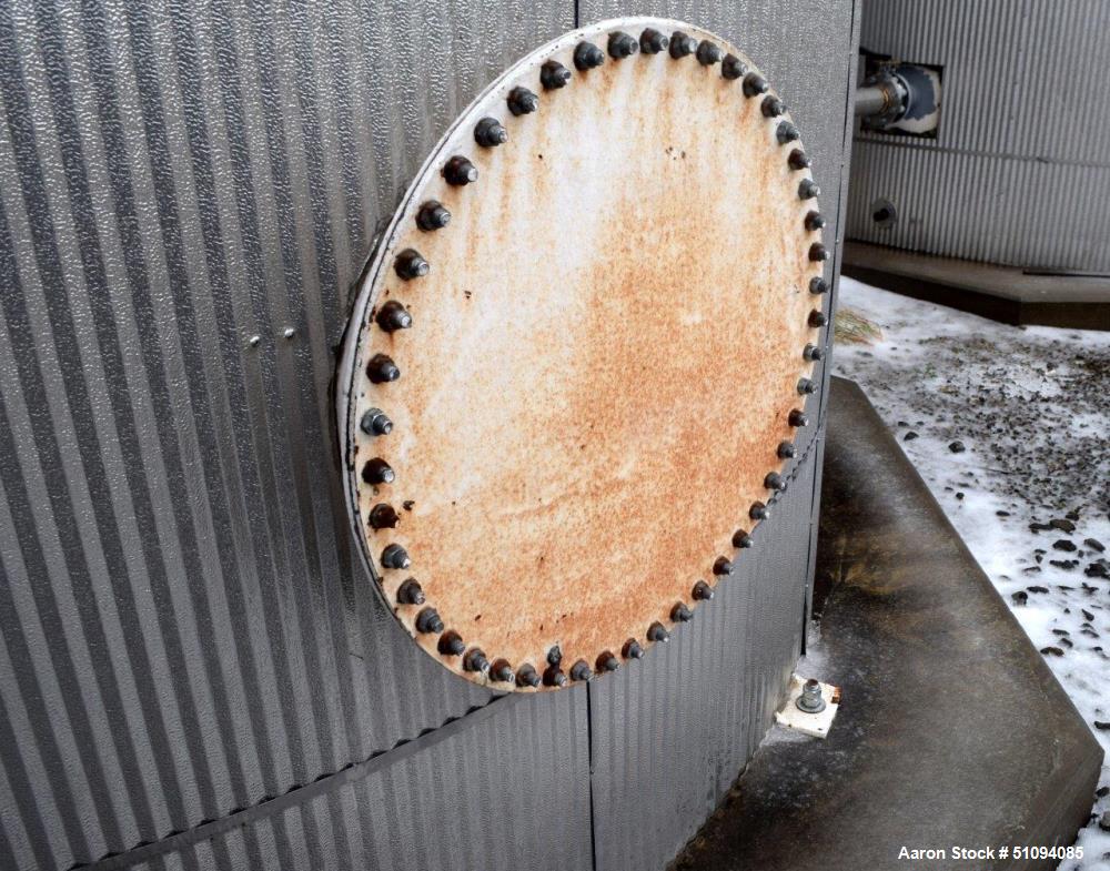 Used Tank, Approximate 29,000 Gallon, Carbon Steel, Vertical. Approximate 144" diameter x 420" straight side, cone top, flat bottom. Side man way and side outlet. No manufacturers tag visible.  ** Th...