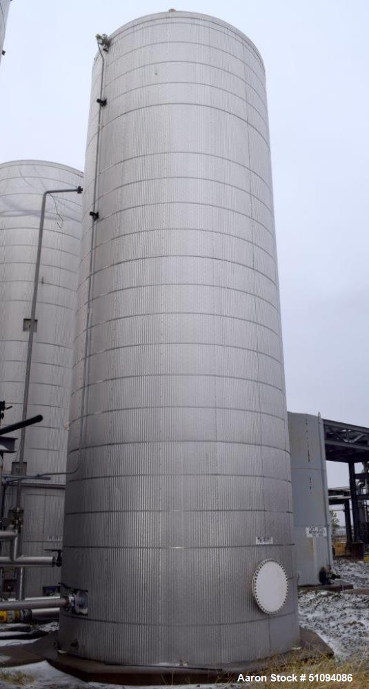 Used Tank, Approximate 29,000 Gallon, Carbon Steel, Vertical. Approximate 144" diameter x 420" straight side, cone top, flat bottom. Side man way and side outlet. No manufacturers tag visible. ** Thi...