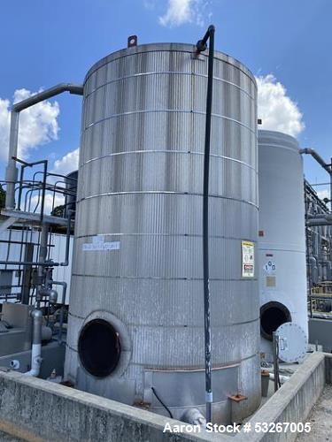 Used approximately 9000 gallon carbon steel vertical storage tank.