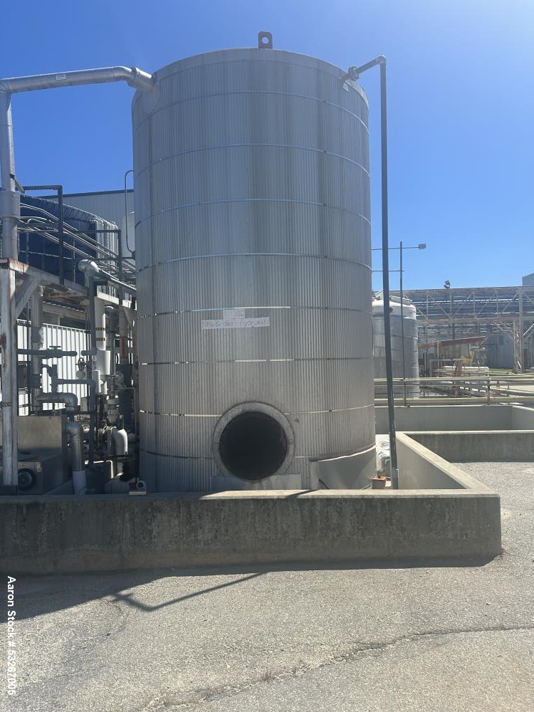 Used approximately 9000 gallon carbon steel vertical storage tank.