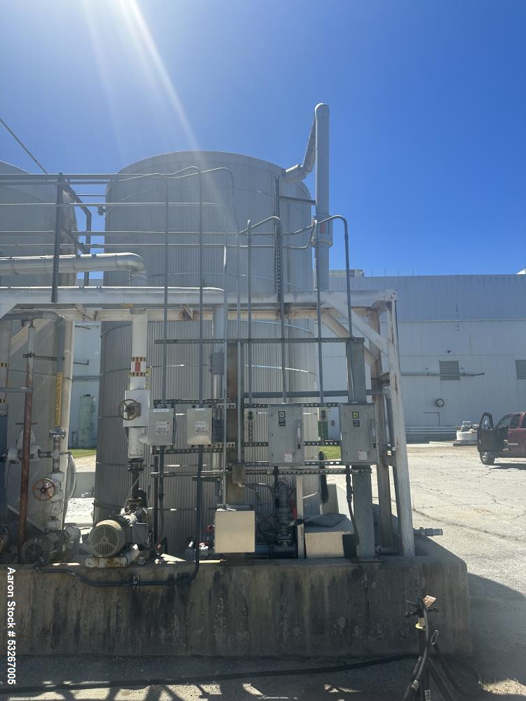 Used approximately 9000 gallon carbon steel vertical storage tank.