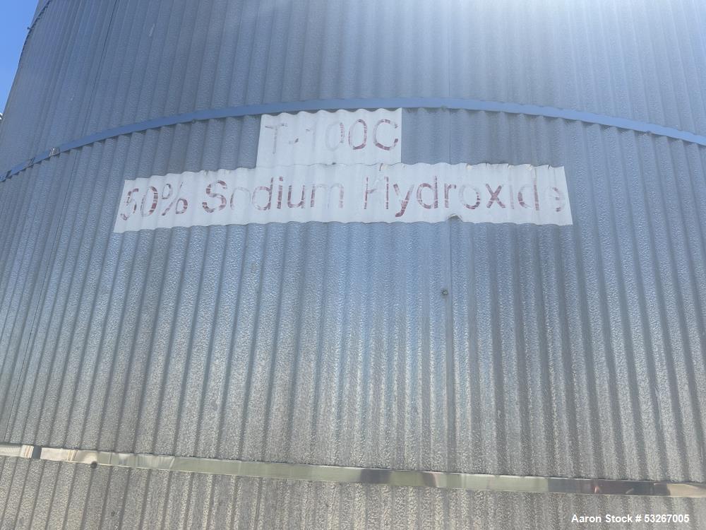 Used approximately 9000 gallon carbon steel vertical storage tank.