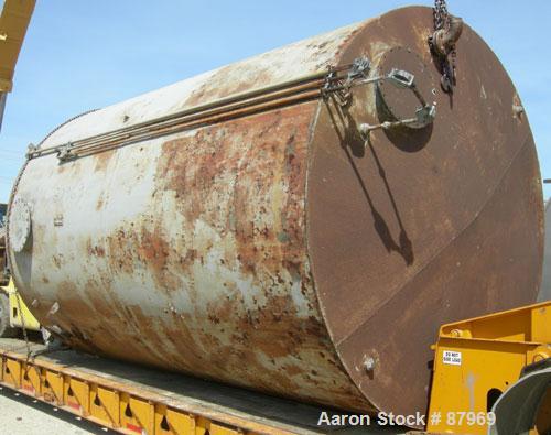 USED: Tank, 10,300 gallon, carbon steel, vertical. 10'6" diameter x 16' straight side. Slight coned top, flat bottom. Side bottom Lightnin agitator, model SG200,1 1/2" diameter x 18" long carbon stee...