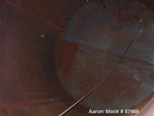 USED: Tank, 10,300 gallon, carbon steel, vertical. 10'6" diameter x 16' straight side. Slight coned top, flat bottom. Side bottom Lightnin agitator, model SG200,1 1/2" diameter x 18" long carbon stee...