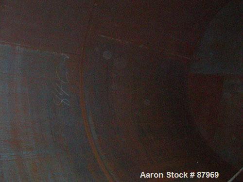 USED: Tank, 10,300 gallon, carbon steel, vertical. 10'6" diameter x 16' straight side. Slight coned top, flat bottom. Side bottom Lightnin agitator, model SG200,1 1/2" diameter x 18" long carbon stee...
