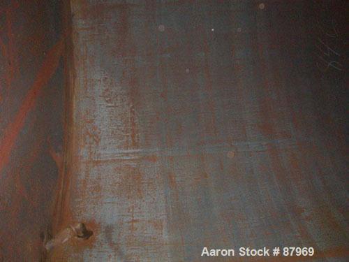 USED: Tank, 10,300 gallon, carbon steel, vertical. 10'6" diameter x 16' straight side. Slight coned top, flat bottom. Side bottom Lightnin agitator, model SG200,1 1/2" diameter x 18" long carbon stee...