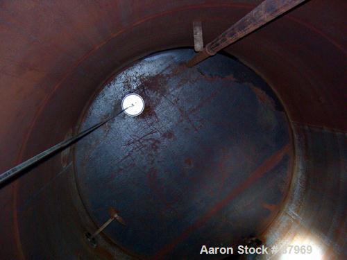 USED: Tank, 10,300 gallon, carbon steel, vertical. 10'6" diameter x 16' straight side. Slight coned top, flat bottom. Side bottom Lightnin agitator, model SG200,1 1/2" diameter x 18" long carbon stee...