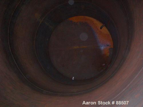 USED: Clawson tank, 15,000 gallon, carbon steel, vertical. 10'6" diameter x 24' straight side. Cone top, flat bottom. Internal rated atmos at 70 deg F. Openings: top 2-1/2", (2) 3", (3) 4", 20"; side...