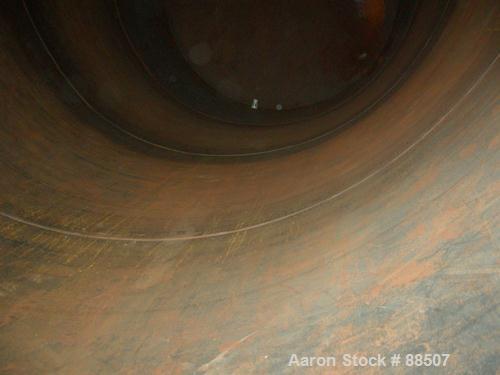 USED: Clawson tank, 15,000 gallon, carbon steel, vertical. 10'6" diameter x 24' straight side. Cone top, flat bottom. Internal rated atmos at 70 deg F. Openings: top 2-1/2", (2) 3", (3) 4", 20"; side...