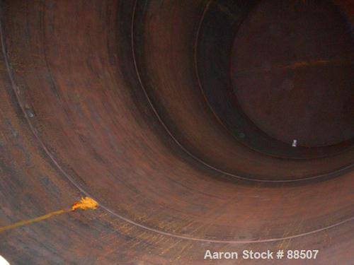 USED: Clawson tank, 15,000 gallon, carbon steel, vertical. 10'6" diameter x 24' straight side. Cone top, flat bottom. Internal rated atmos at 70 deg F. Openings: top 2-1/2", (2) 3", (3) 4", 20"; side...