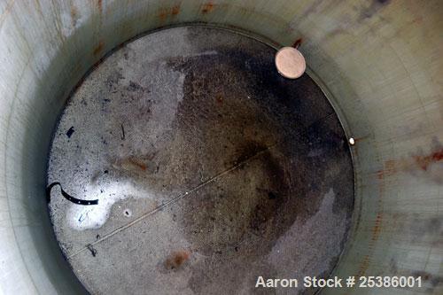Used Highland Tank, 7800 Gallon, Carbon Steel, Vertical. 132" Diameter x 132" straight side, coned top, flat bottom. Openings top (2) approximate 4-1/4" NPT, 23-1/2" man way with cover, side approxim...
