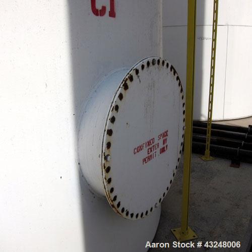 Used Highland Tank, 16,920 Gallon, Carbon Steel, Vertical. Approximately 12' diameter x 20' straight side, slight coned top, flat bottom. U.L. 142 labeled for above ground flammable storage. Openings...