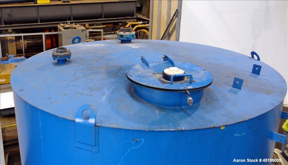 Used International Production Specialist Tank, 6700 Gallon, Carbon Steel, Vertical. Approximate 120" diameter x 138" straight side, slight coned top, flat bottom. Openings top 2", 4" 24" man way with...