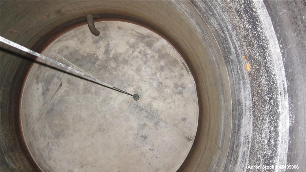 Used  International Production Specialists 7000 Gallon Verical Carbon Steel Storage Tank. Coned top, flat bottom. 123" diameter X 138" straight side. Top openings 2", 4" (2) 3", 6", 24" manway with c...