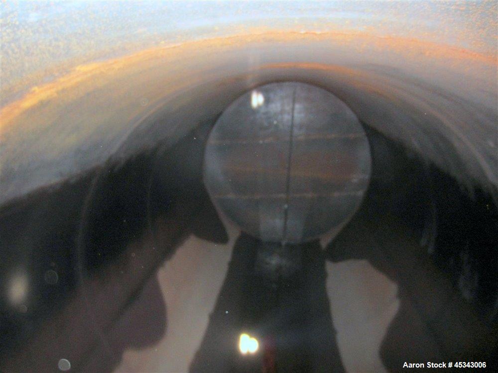 Used International Production Specialists Tank, Approximately 30,000 Gallons. Double wall, carbon steel, horizontal, flat heads.  12' Diameter x 490" straight side.  Various top openings.  Mounted on...
