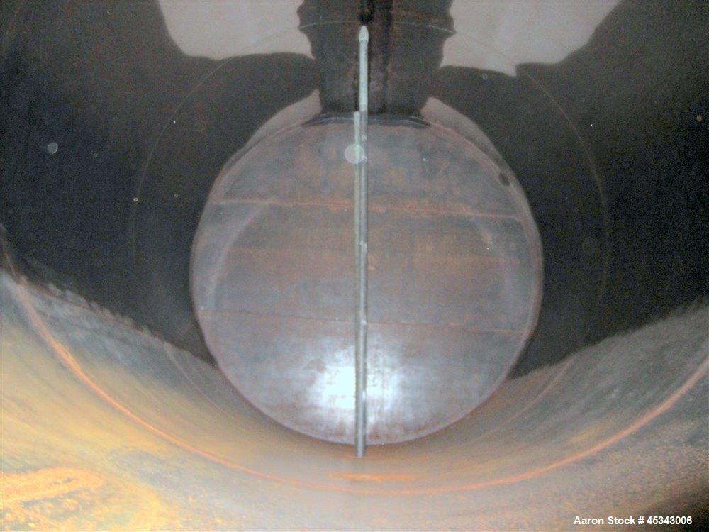 Used International Production Specialists Tank, Approximately 30,000 Gallons. Double wall, carbon steel, horizontal, flat heads.  12' Diameter x 490" straight side.  Various top openings.  Mounted on...