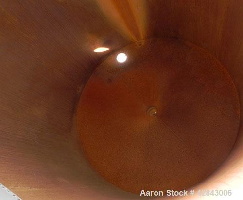Used Tank, Carbon Steel, 9,500 Gallon, Vertical. Approximately 120" diameter x 192" straight side. Slight coned top and bottom. Openings top 8", 36" x 24" Side bottom opening, 3-1/2" tangential cente...