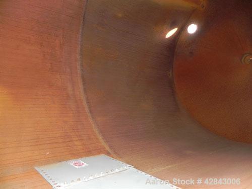 Used Tank, Carbon Steel, 9,500 Gallon, Vertical. Approximately 120" diameter x 192" straight side. Slight coned top and bottom. Openings top 8", 36" x 24" Side bottom opening, 3-1/2" tangential cente...