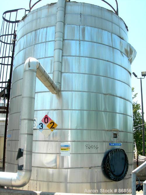 USED: Wolfe Mechanical and Equipment tank, 13,600 gallon, carbon steel, vertical. Approximate 144" diameter x 192" straight side. Dish top, flat bottom. Openings: top (3) 3", 1-1/2"; side 3/4", 1", 1...