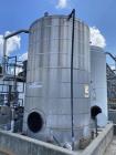 Used approximately 9000 gallon carbon steel vertical storage tank.