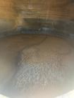 Used- approximately 9000 gallon carbon steel vertical storage tank.