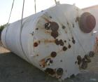 USED: Clawson tank, 9,000 gallon, carbon steel. Approximately 8' diameter x 24' straight side. Slight coned top, flat bottom. Internal rated atmos at 70 deg F. Openings: top 2