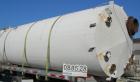 USED: Clawson tank, 9,000 gallon, carbon steel. Approximately 8' diameter x 24' straight side. Slight coned top, flat bottom. Internal rated atmos at 70 deg F. Openings: top 2