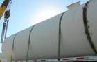 USED: Clawson tank, 9,000 gallon, carbon steel. Approximately 8' diameter x 24' straight side. Slight coned top, flat bottom. Internal rated atmos at 70 deg F. Openings: top 2