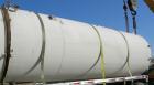 USED: Clawson tank, 9,000 gallon, carbon steel. Approximately 8' diameter x 24' straight side. Slight coned top, flat bottom. Internal rated atmos at 70 deg F. Openings: top 2