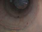 USED: Clawson tank, 9,000 gallon, carbon steel. Approximately 8' diameter x 24' straight side. Slight coned top, flat bottom. Internal rated atmos at 70 deg F. Openings: top 2