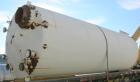 USED: Clawson tank, 9,000 gallon, carbon steel. Approximately 8' diameter x 24' straight side. Slight coned top, flat bottom. Internal rated atmos at 70 deg F. Openings: top 2