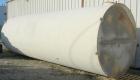 USED: Clawson tank, 9,000 gallon, carbon steel. Approximately 8' diameter x 24' straight side. Slight coned top, flat bottom. Internal rated atmos at 70 deg F. Openings: top 2