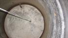 Used  International Production Specialists 7000 Gallon Verical Carbon Steel Storage Tank. Coned top, flat bottom. 123