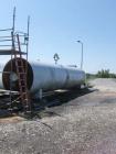 Used CO2 tank, certified by Tomco Equipment Co, manufacture date 1984, holds 76,000 lbs, carbon steel, approximately 39' long x 9' tall x 6'6