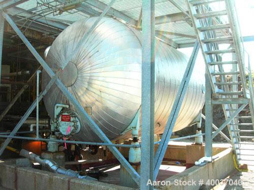 Used: Pfaudler glass lined tank, 10,000 gallon, 9119 blue glass, horizontal. Approximately 10' diameter x 14' straight side, dished heads. Internal rated 50/fv at 450 deg.f.. Openings top (6) 4". Hea...