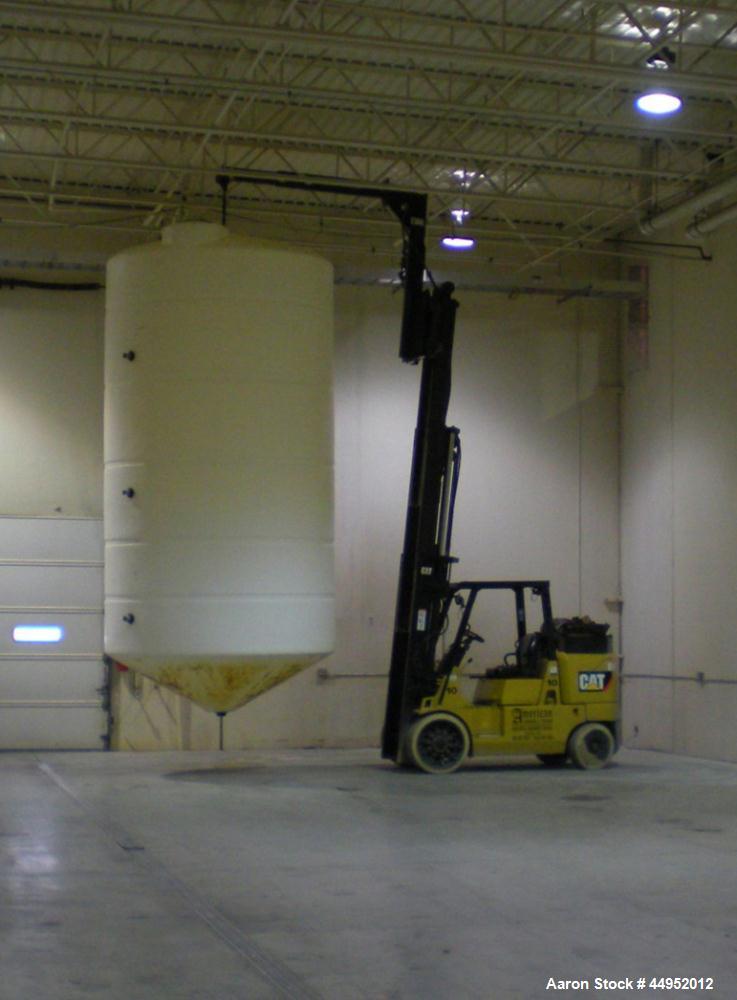 Used Plastic Tank, 6,000 Gallon, Vertical.  102" Diameter x 195" high, cone bottom, dome top, 30" twist off manway cover, 3" outlet.  Tank is for food grade material, on metal frame.