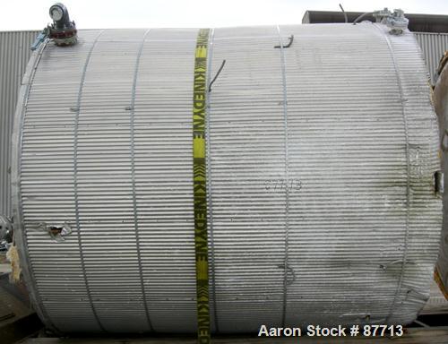 USED: Tank, 6200 gallon, fiberglass, vertical. Approximately 116" diameter X 136" straight side. Slight cone top, flat bottom. Openings:  top 2", (3) 1", 24" manway, no cover, side bottom 24" side ma...