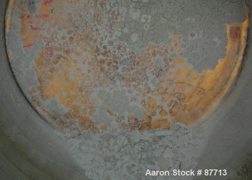 USED: Tank, 6200 gallon, fiberglass, vertical. Approximately 116" diameter X 136" straight side. Slight cone top, flat bottom. Openings:  top 2", (3) 1", 24" manway, no cover, side bottom 24" side ma...