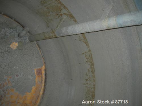 USED: Tank, 6200 gallon, fiberglass, vertical. Approximately 116" diameter X 136" straight side. Slight cone top, flat bottom. Openings:  top 2", (3) 1", 24" manway, no cover, side bottom 24" side ma...