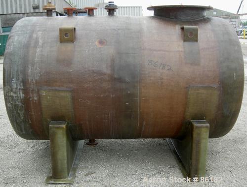 USED: Empire Products tank, 1200 gallon, fiberglass, horizontal. Approximate 58" diameter x 92" straight side. 1 dished end, 1 flat end. Top openings: (4) 3" flange, (1) 24" manway with bolt-on cover...