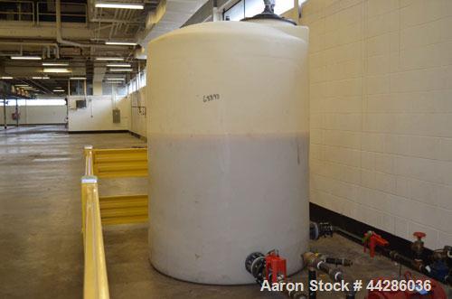 Used Poly Processing Company Vertical Poly Storage Tank, 1,100 Gallon. (3) 4” Diameter Side Bottom Inlets and Outlets, approximate 18” diameter top covered man way.