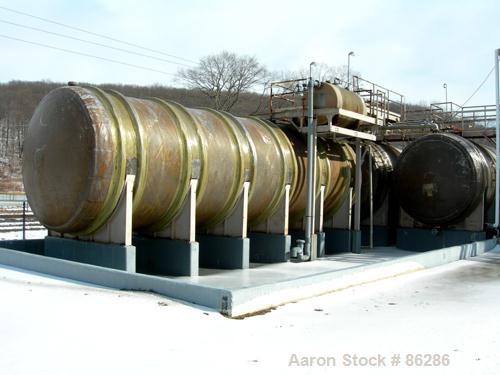 USED: Wallace Murray tank, 34,000 gallon, fiberglass, horizontal. Approx 144" diameter x 40' long. Dished ends. End bottom outlet. Mounted on carbon steel saddles.