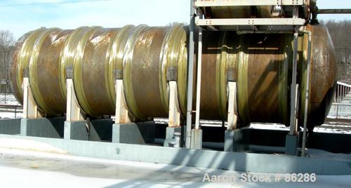 USED: Wallace Murray tank, 34,000 gallon, fiberglass, horizontal. Approx 144" diameter x 40' long. Dished ends. End bottom outlet. Mounted on carbon steel saddles.